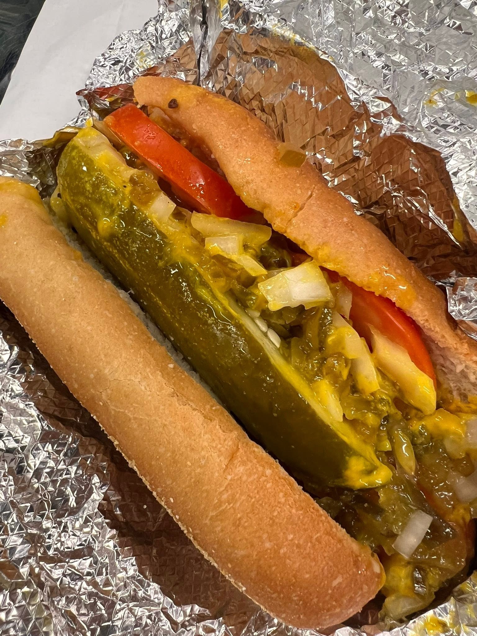 Chicago Dog from Donny's Dogs with a pickle spear, tomato slices, diced onions, relish and mustard