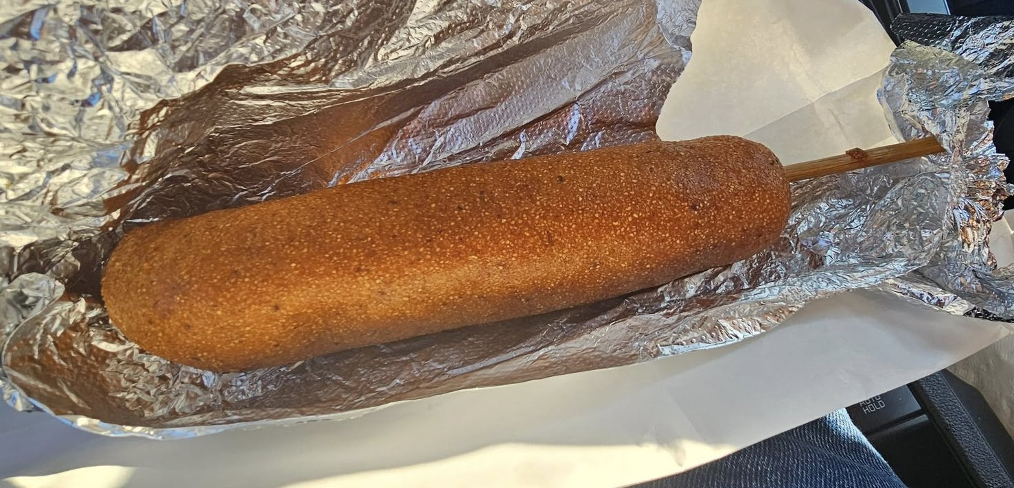 Golden beer-battered signature corndog from Donny's Dogs
