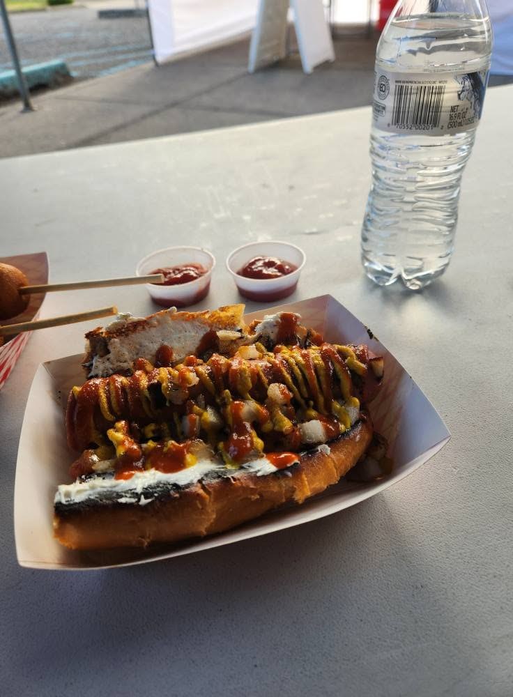 Seattle Dog from Donny's Dogs with cream cheese, sriracha and mustard on a toasted bun